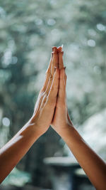 Close-up of woman hand against blurred background