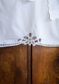 Close-up of textile on wooden furniture