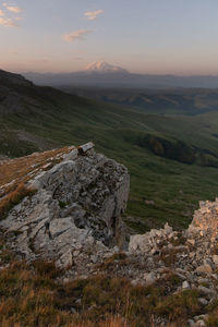 Scenic view of mountains against sky during sunset