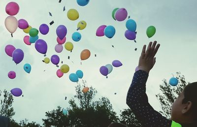 Group of people in front of balloons