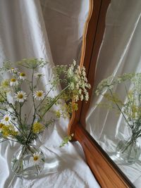 High angle view of white flower vase on table