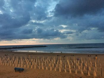 Scenic view of beach against sky during sunset