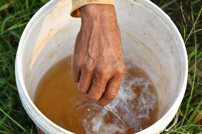 High angle view of person preparing food in container