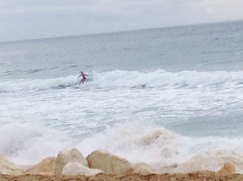 Man surfing in sea