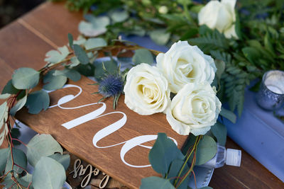 High angle view of rose bouquet on white table