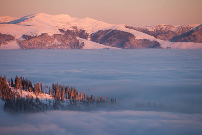 Scenic view of mountains against sky during winter