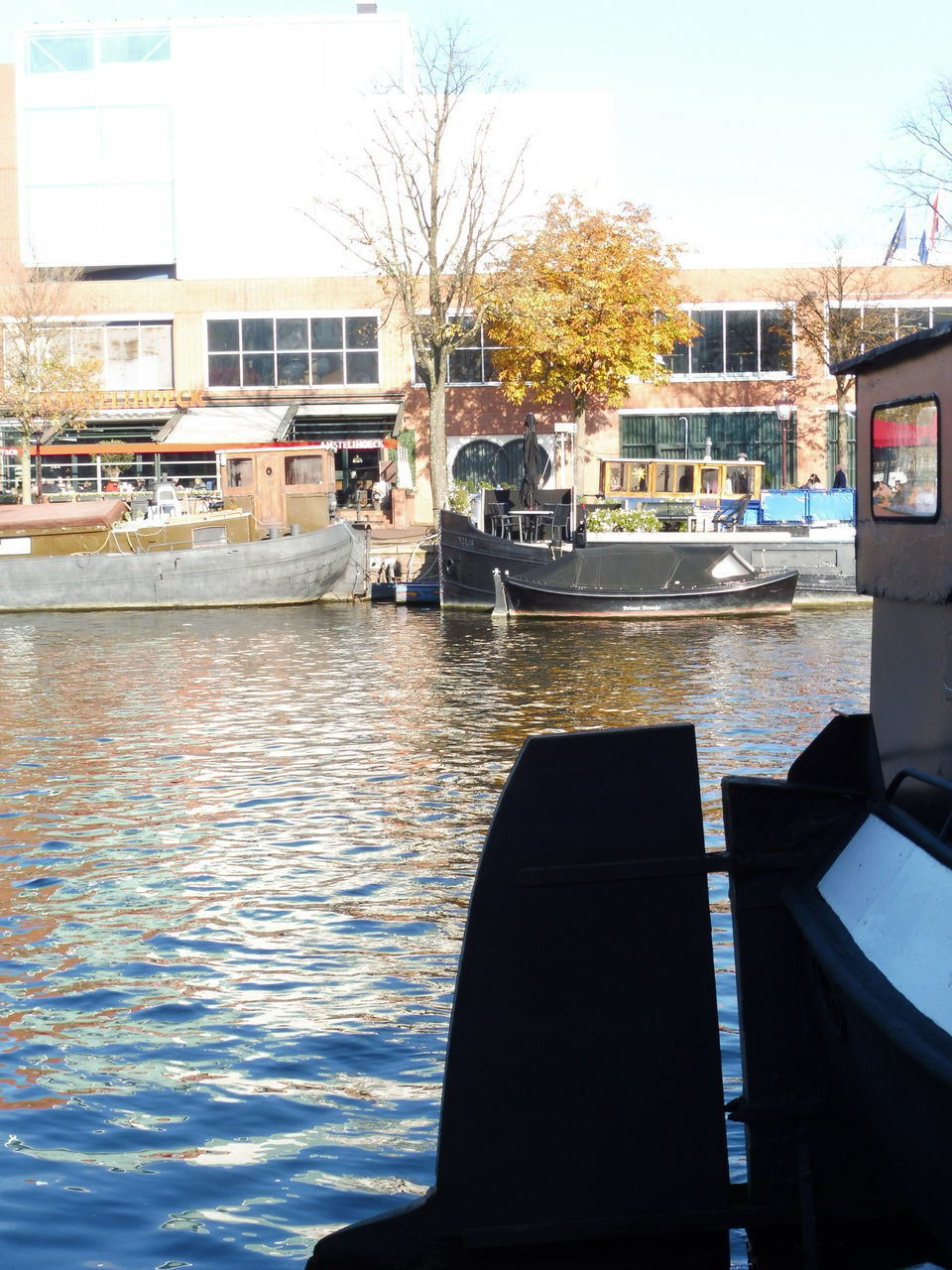 CANAL BY BUILDINGS IN CITY