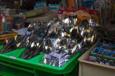 Close-up of cutlery for sale at market stall