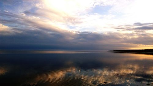 Scenic view of sea against sky at sunset