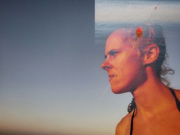 Side view of young woman looking away