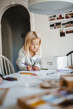 Girl at home doing homework