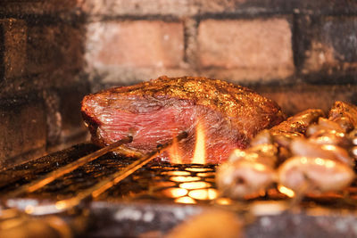 Close-up of meat on barbecue grill