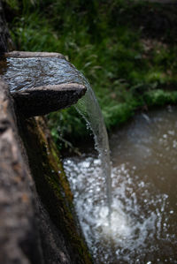 Close-up of water flowing on rock