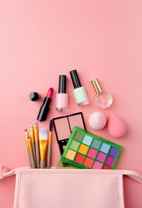 High angle view of beauty products on pink background