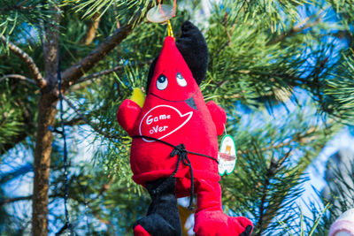 Low angle view of christmas decoration hanging on tree