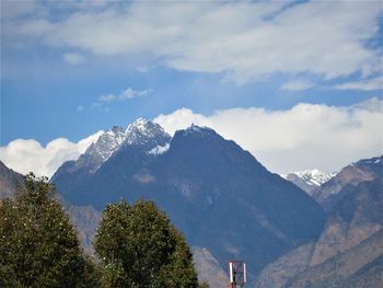 Scenic view of snowcapped mountains against sky