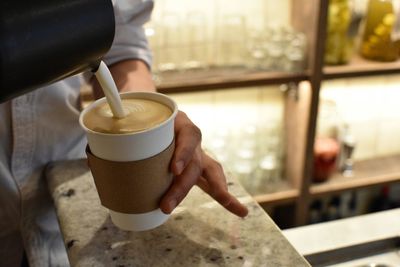 Close-up of barista making coffee