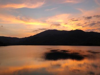 Scenic view of lake against sky during sunset
