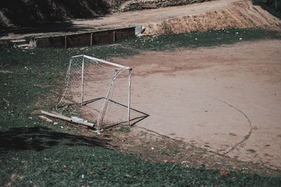 High angle view of empty deck chairs on field