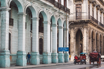 People in front of historical building