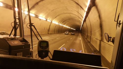 Cars in illuminated underground walkway