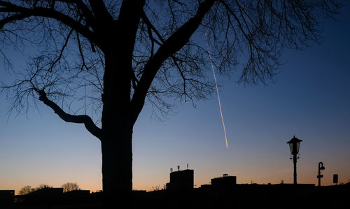 Low angle view of silhouette tree against sky at sunset