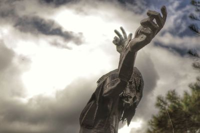 Low angle view of statue against sky