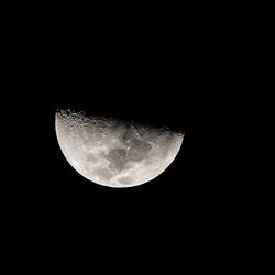 Low angle view of moon against sky at night