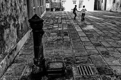 People walking on street in city