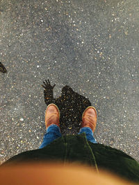 Low section of man standing on floor