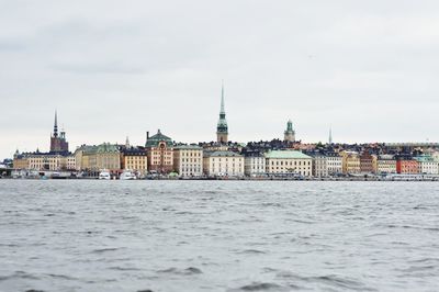 View of buildings in city against sky