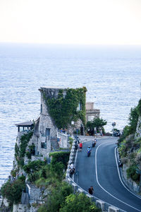 High angle view of road by sea against sky
