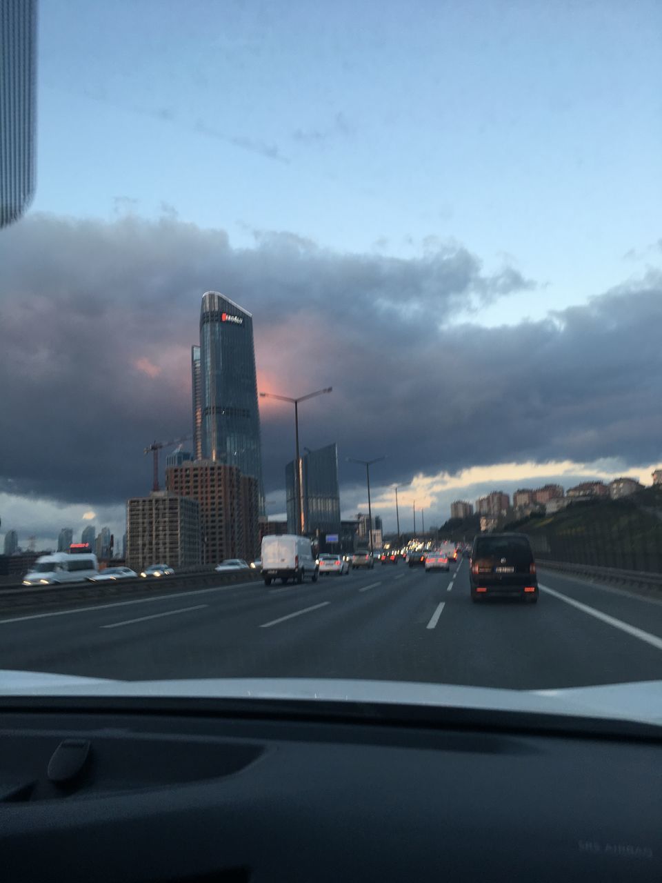 CARS ON ROAD IN CITY