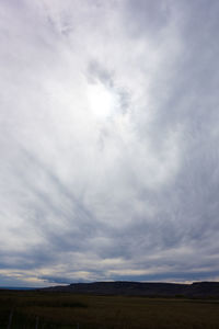 Low angle view of field against sky