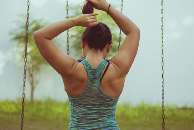 Close-up of woman standing against sky