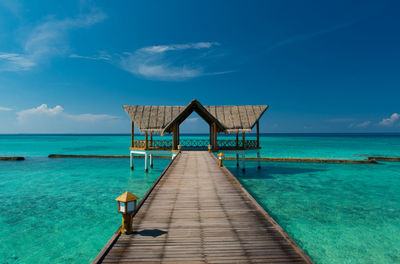 Pier over sea against sky