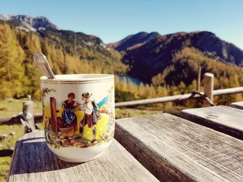 Close-up of food on table against mountains