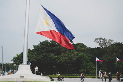 Flags flying against clear sky