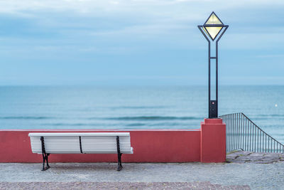 Lifeguard hut at beach against sky