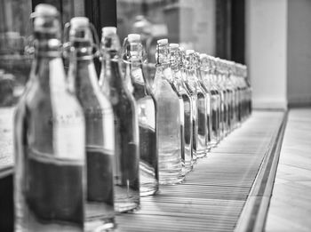 Close-up of glass bottles on table