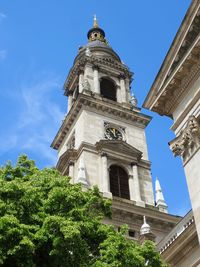 Low angle view of bell tower against sky