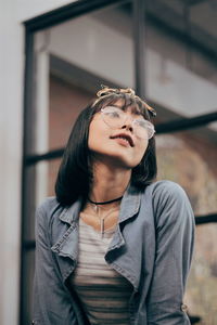 Portrait of beautiful young woman looking away