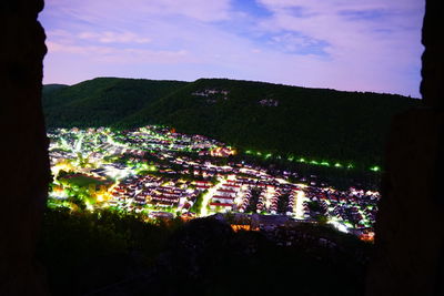 High angle view of illuminated buildings in city at night