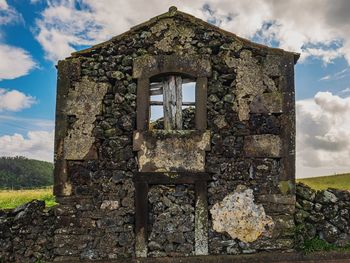 Low angle view of old building against sky