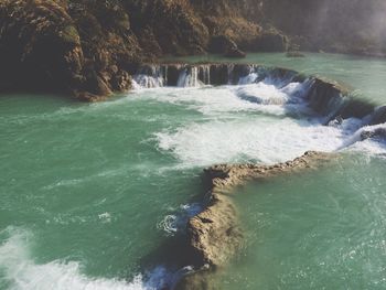 Waves splashing on rocks