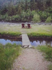 Gazebo on field by lake