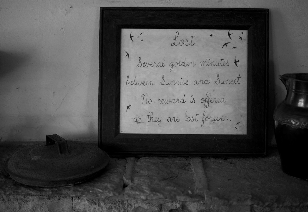 black, white, black and white, still life photography, monochrome, darkness, text, monochrome photography, indoors, no people, communication, lighting, handwriting, picture frame, wall - building feature, old, retro styled, history, western script, light, the past