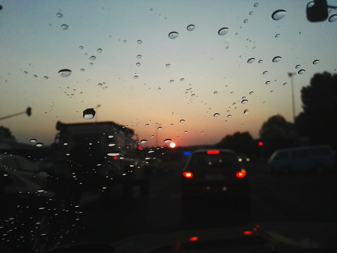 ROAD VIEWED THROUGH CAR WINDSHIELD