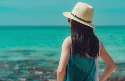 Rear view of woman looking at sea