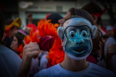Close-up of man wearing mask at event